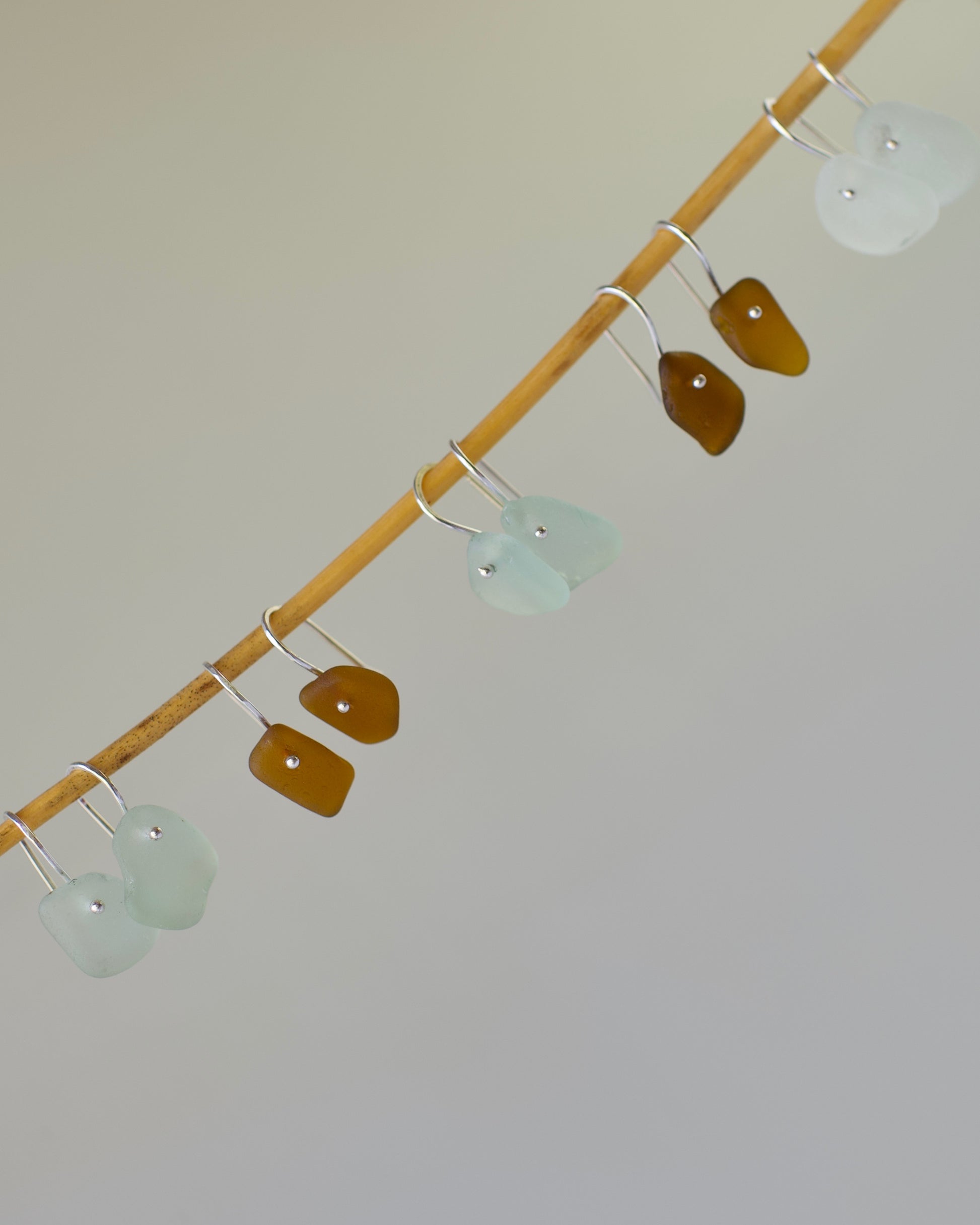 5 pairs of beach glass french wire earrings in amber and light aqua beach glass