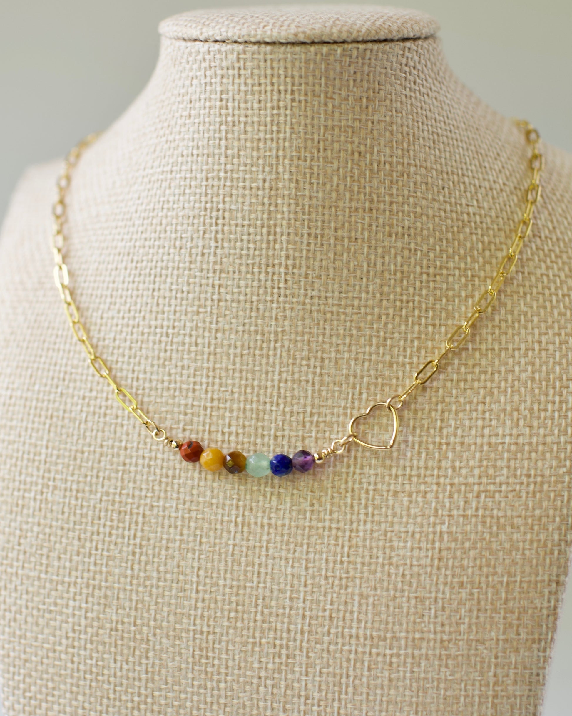 14k usa Gold fill paperclip necklace with natural stone rainbow beads on a mannequin bust.